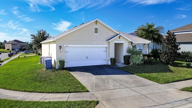 single story home with a garage and a front lawn