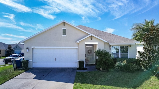 ranch-style home with a front yard and a garage