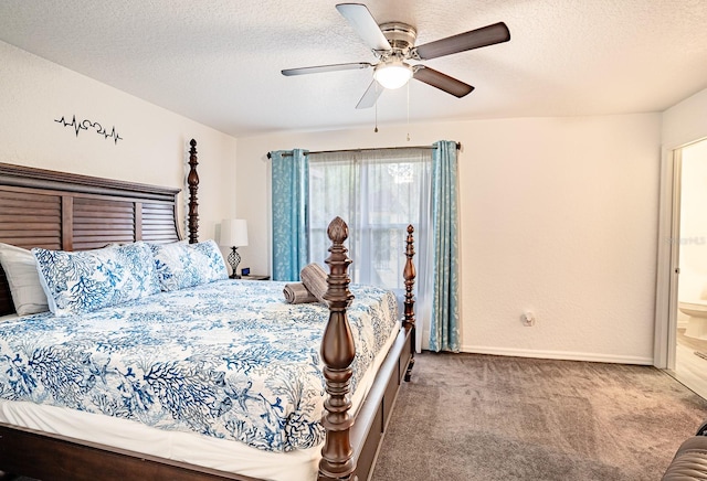 bedroom featuring light carpet, ceiling fan, ensuite bathroom, and a textured ceiling