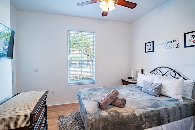 bedroom featuring ceiling fan and light hardwood / wood-style flooring