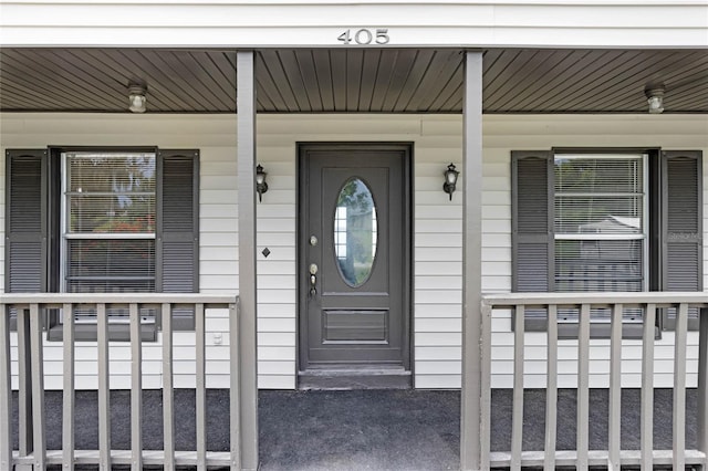 property entrance featuring covered porch