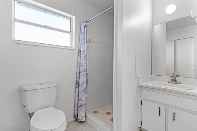 bathroom featuring vanity, curtained shower, tile patterned floors, and toilet