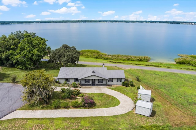 birds eye view of property featuring a water view