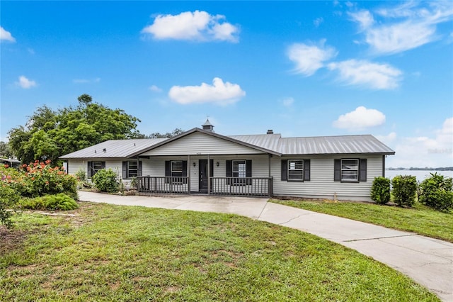 single story home featuring a front lawn and covered porch