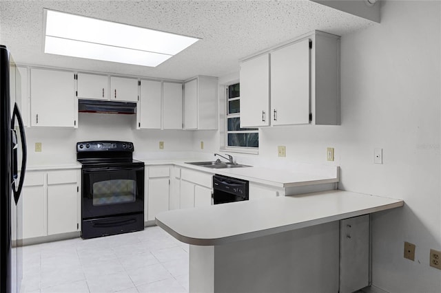 kitchen with sink, kitchen peninsula, white cabinets, and black appliances