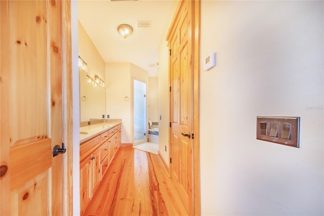 hall with light hardwood / wood-style flooring