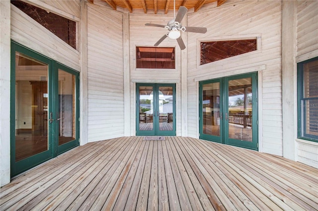 wooden terrace featuring ceiling fan and french doors