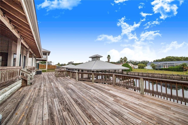 deck with a water view and a gazebo