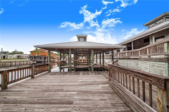 view of dock featuring a water view and a gazebo