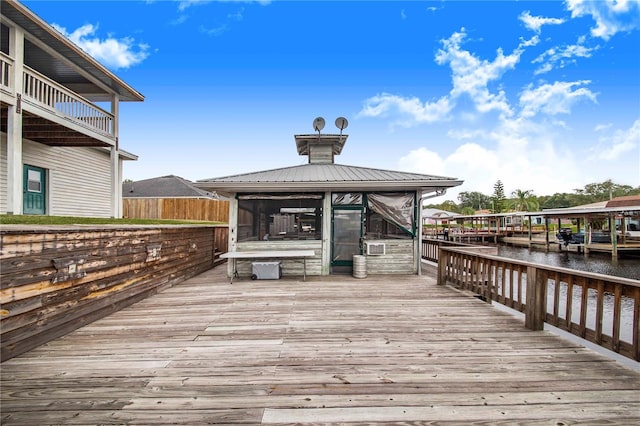 exterior space featuring a gazebo and a water view