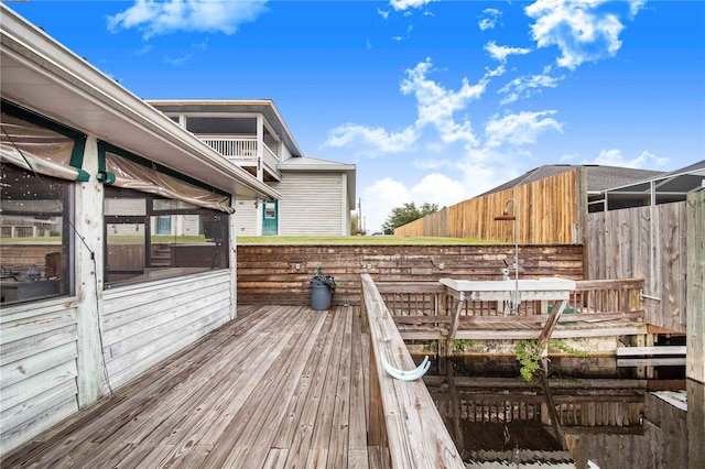 deck with a sunroom