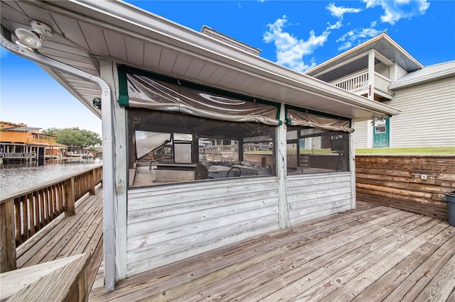 deck with a sunroom