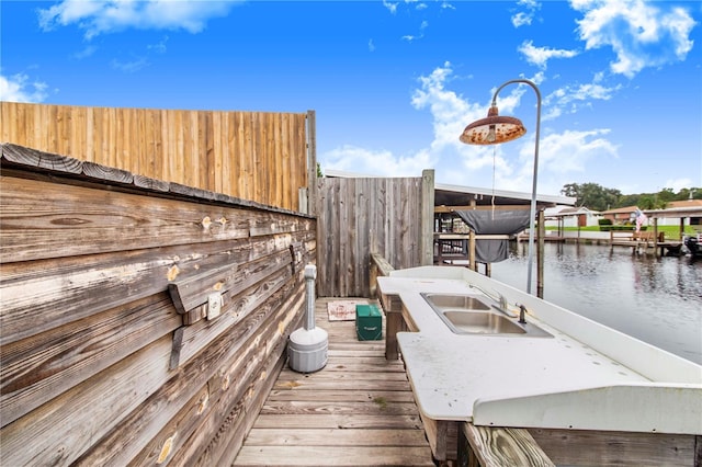 dock area featuring sink and a water view