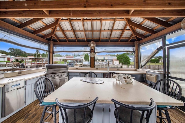 exterior space with lofted ceiling with beams and plenty of natural light