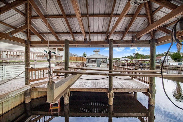 view of dock featuring a water view and a gazebo