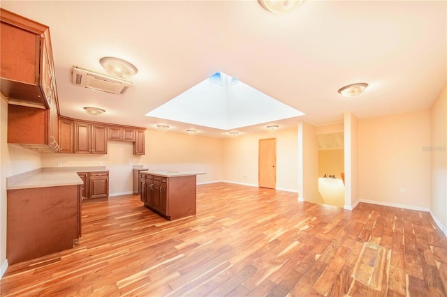 kitchen featuring a center island and light hardwood / wood-style flooring