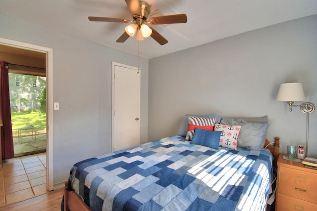 bedroom featuring light wood-type flooring, access to outside, and ceiling fan