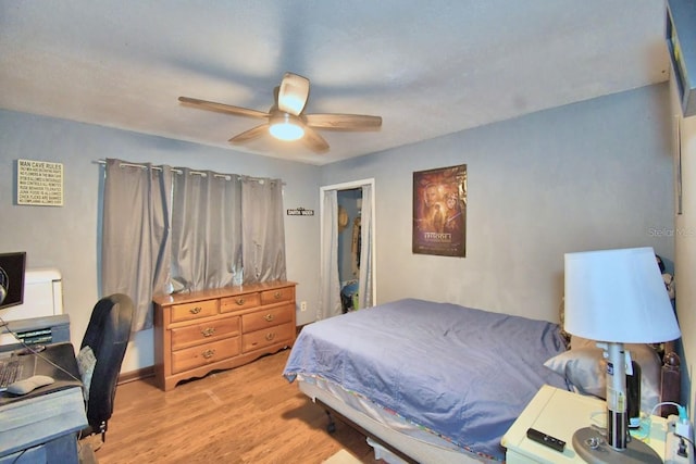 bedroom featuring ceiling fan and light hardwood / wood-style flooring