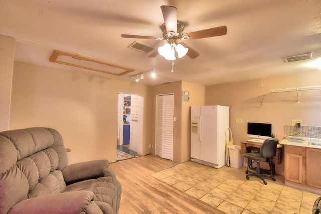 office featuring light hardwood / wood-style flooring and ceiling fan