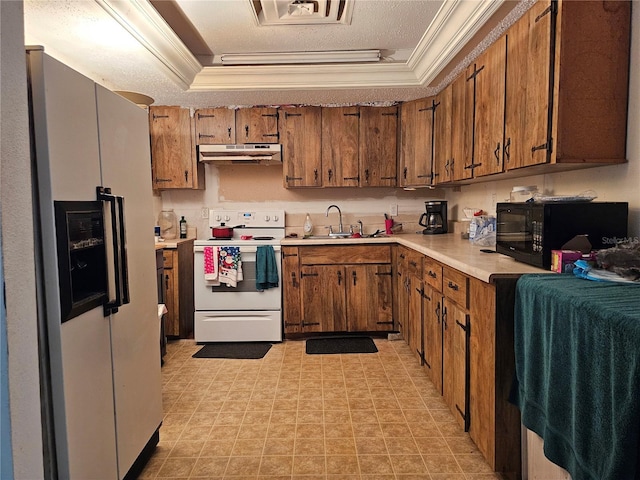 kitchen featuring white appliances, a textured ceiling, sink, and crown molding