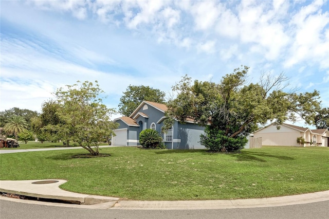 obstructed view of property with a front yard