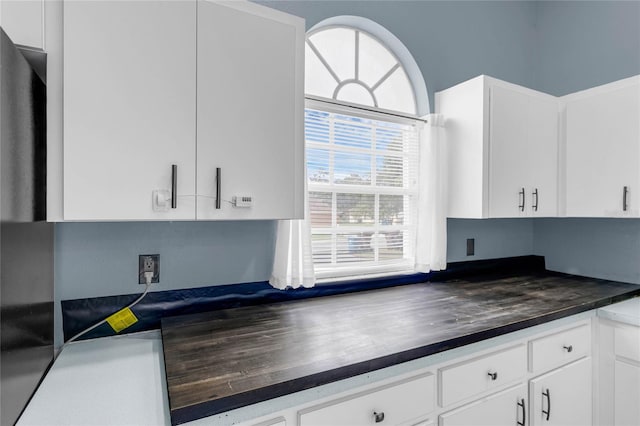 kitchen featuring white cabinets