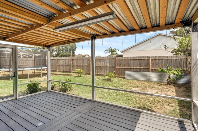 unfurnished sunroom with a wealth of natural light