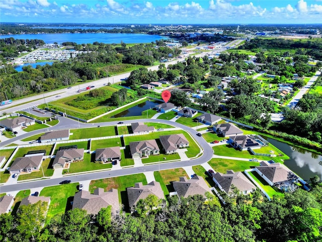 birds eye view of property featuring a water view