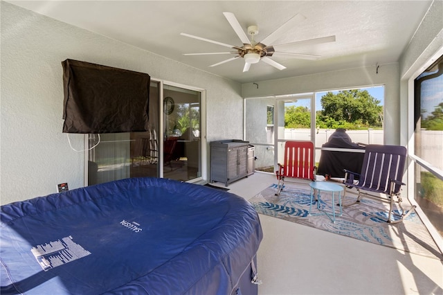 bedroom featuring concrete floors and ceiling fan