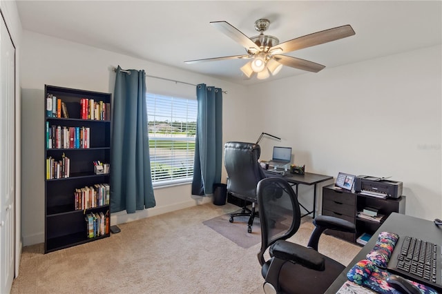 office area with ceiling fan and light colored carpet