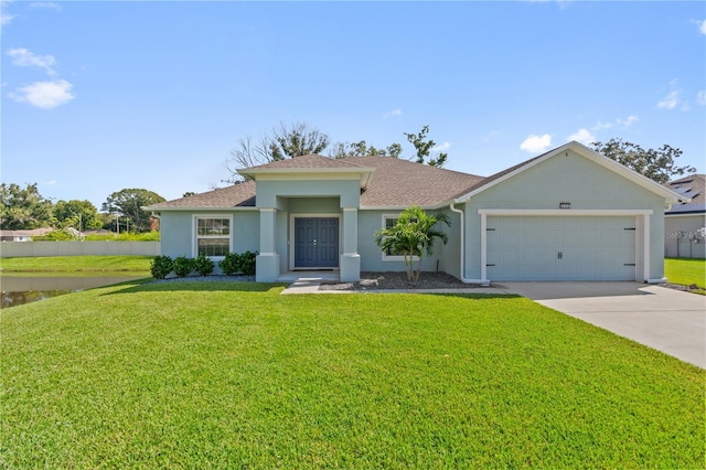 ranch-style home with a garage and a front lawn