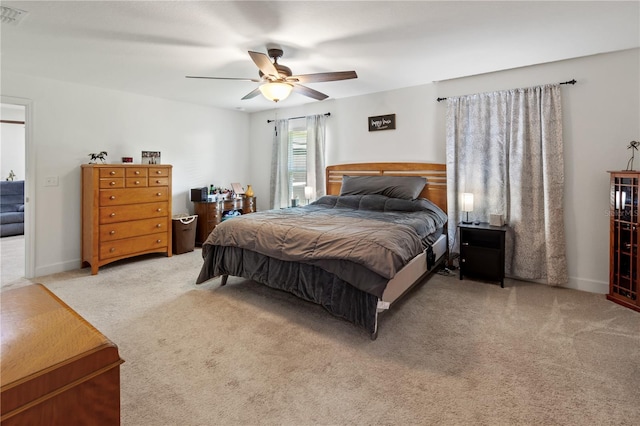 bedroom with ceiling fan and carpet floors