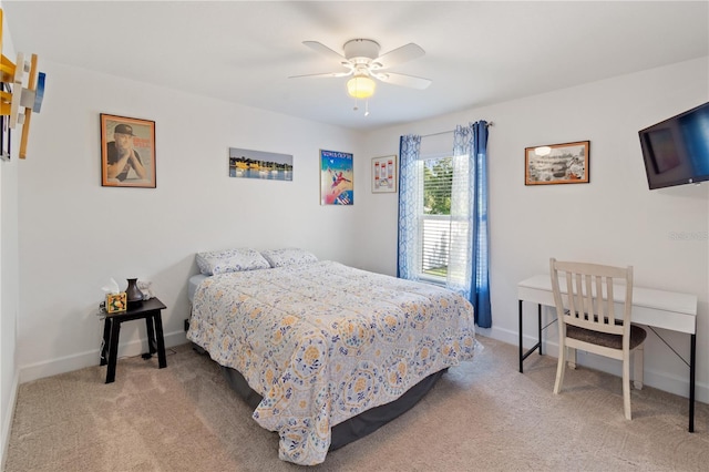 bedroom featuring ceiling fan and light colored carpet