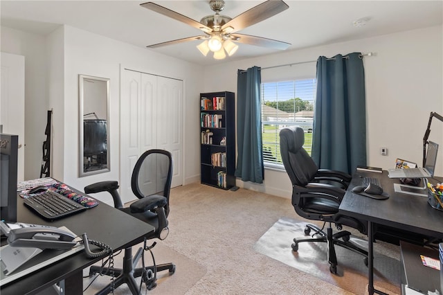 carpeted office with ceiling fan