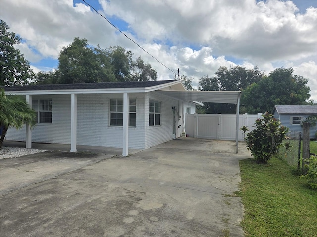 view of front of property with a carport