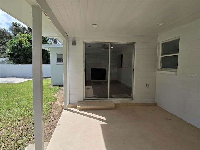 property entrance featuring a yard and a patio area