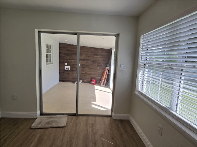 doorway to outside featuring dark hardwood / wood-style flooring