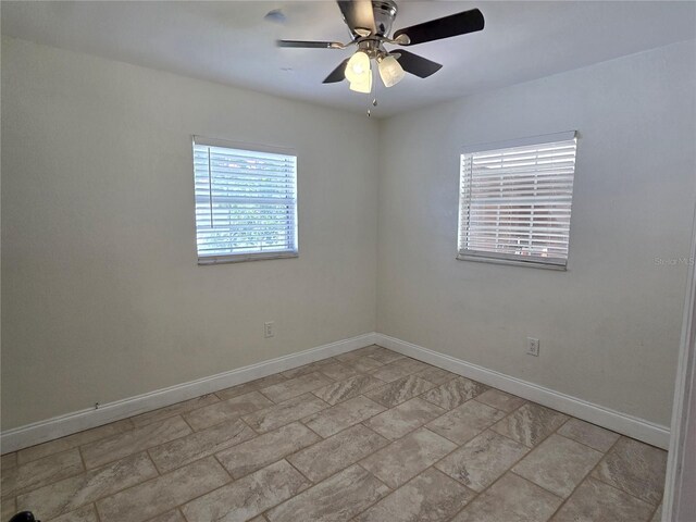 spare room with ceiling fan