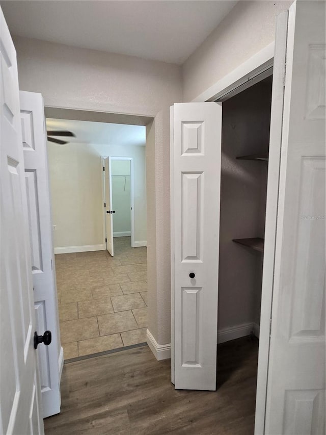 corridor featuring hardwood / wood-style floors