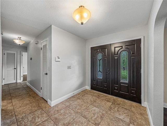 entrance foyer featuring a textured ceiling