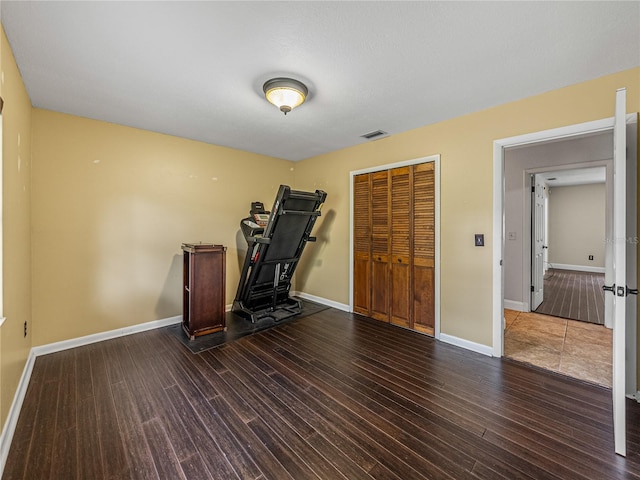 unfurnished office featuring dark hardwood / wood-style floors