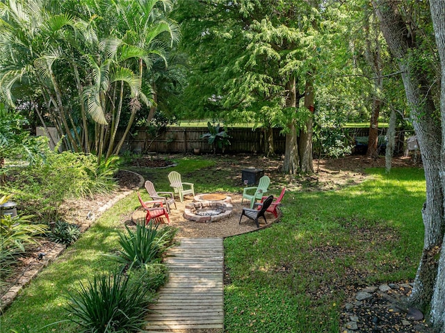 view of yard with a fire pit