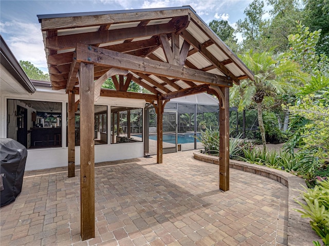 view of patio with area for grilling and a gazebo