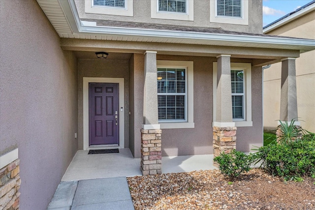 property entrance featuring a porch