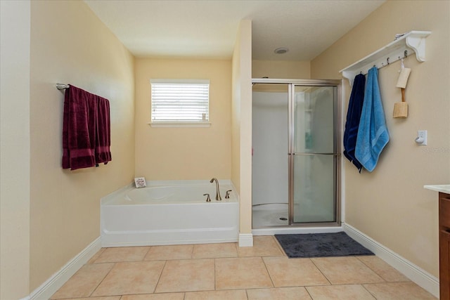 bathroom with vanity, separate shower and tub, and tile patterned floors