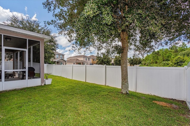 view of yard featuring a sunroom