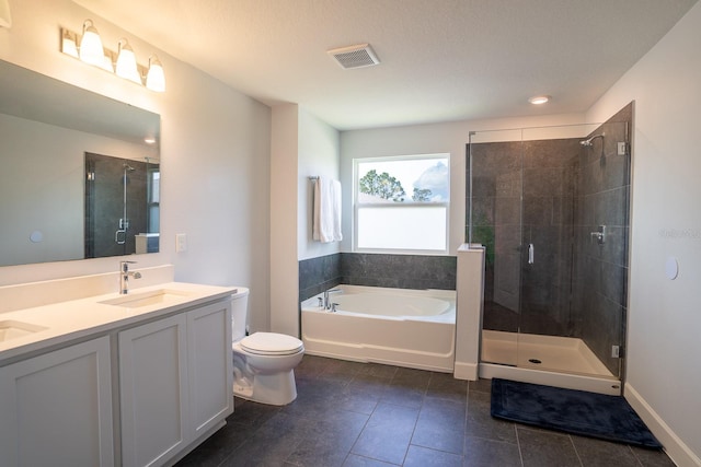 full bathroom featuring vanity, separate shower and tub, toilet, and tile patterned floors