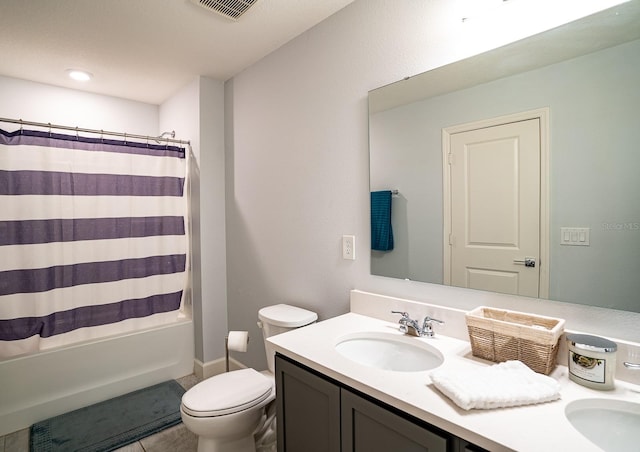 full bathroom featuring shower / tub combo, tile patterned flooring, vanity, and toilet