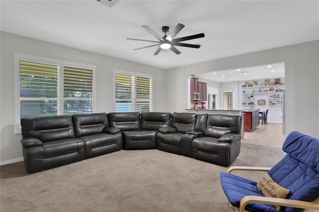 living room with ceiling fan and light carpet