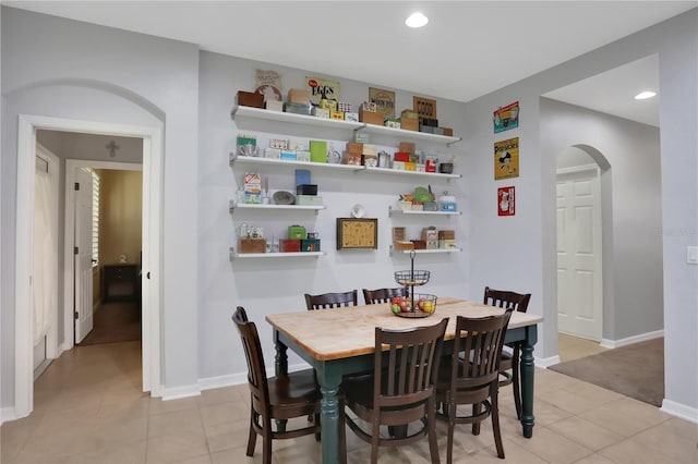 dining space with light tile patterned floors